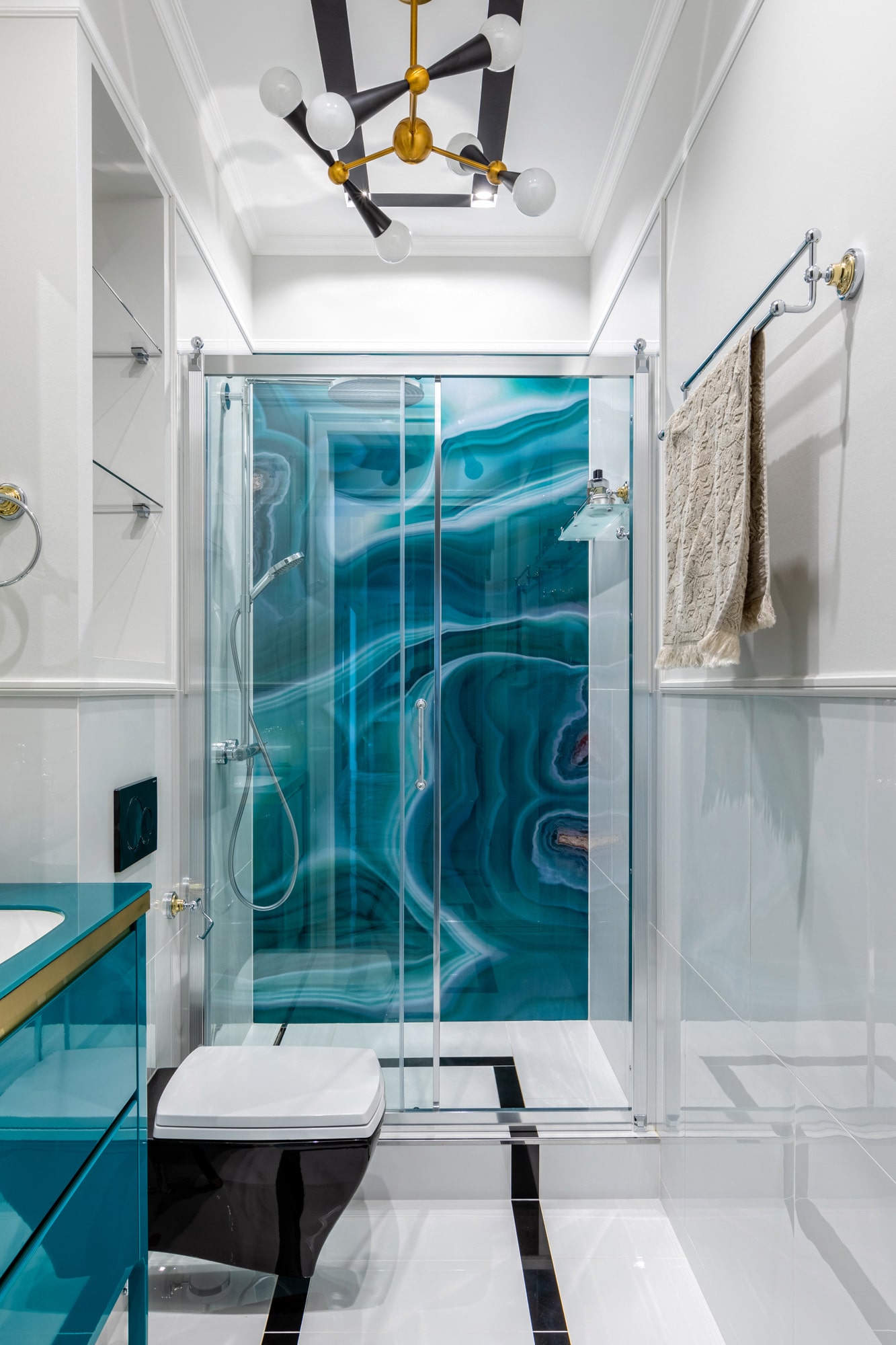 Interior shot of a bathroom with blue marble wall in the shower