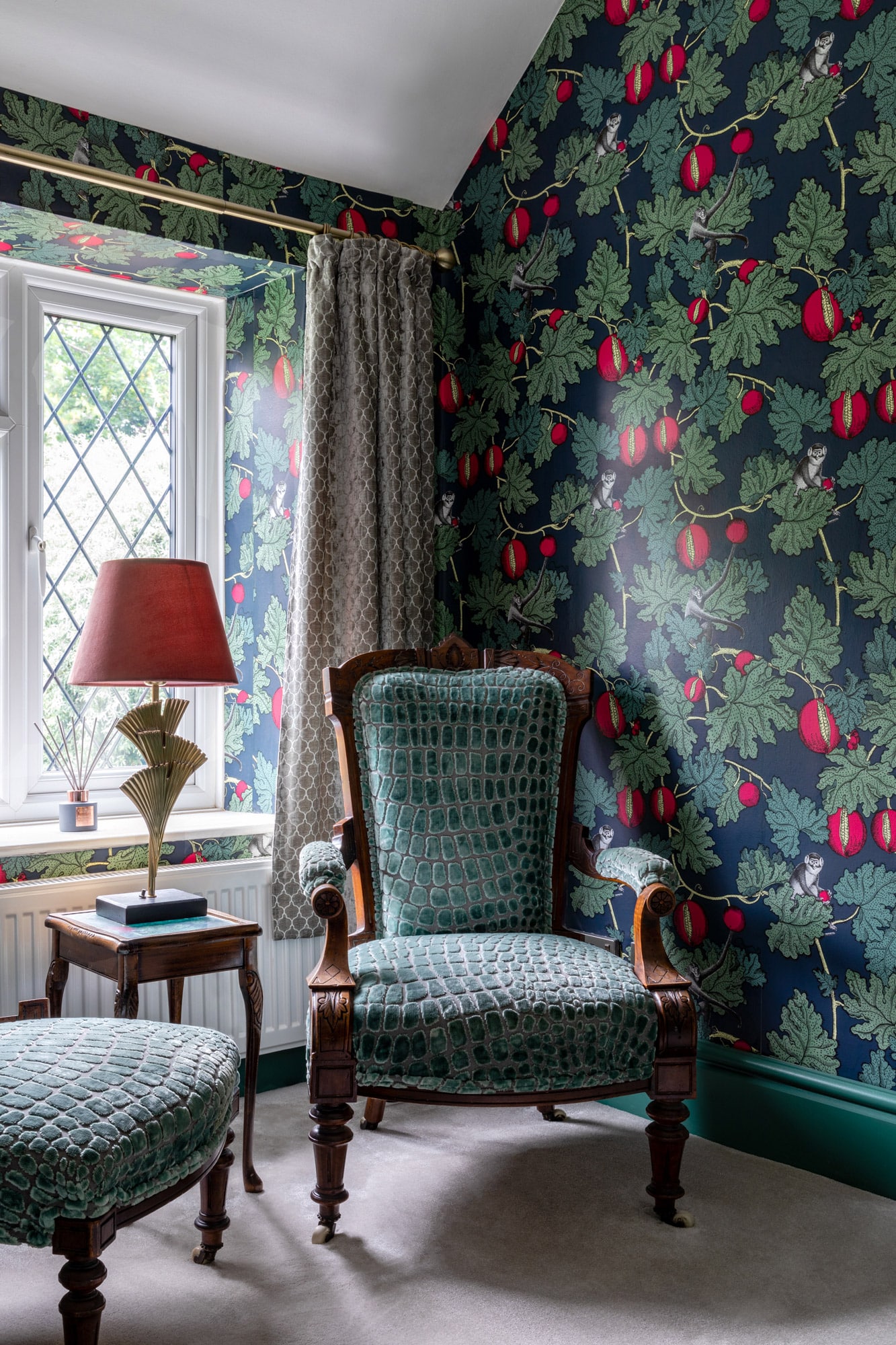 reading nook with two armchairs, table and vibrant wallpapers