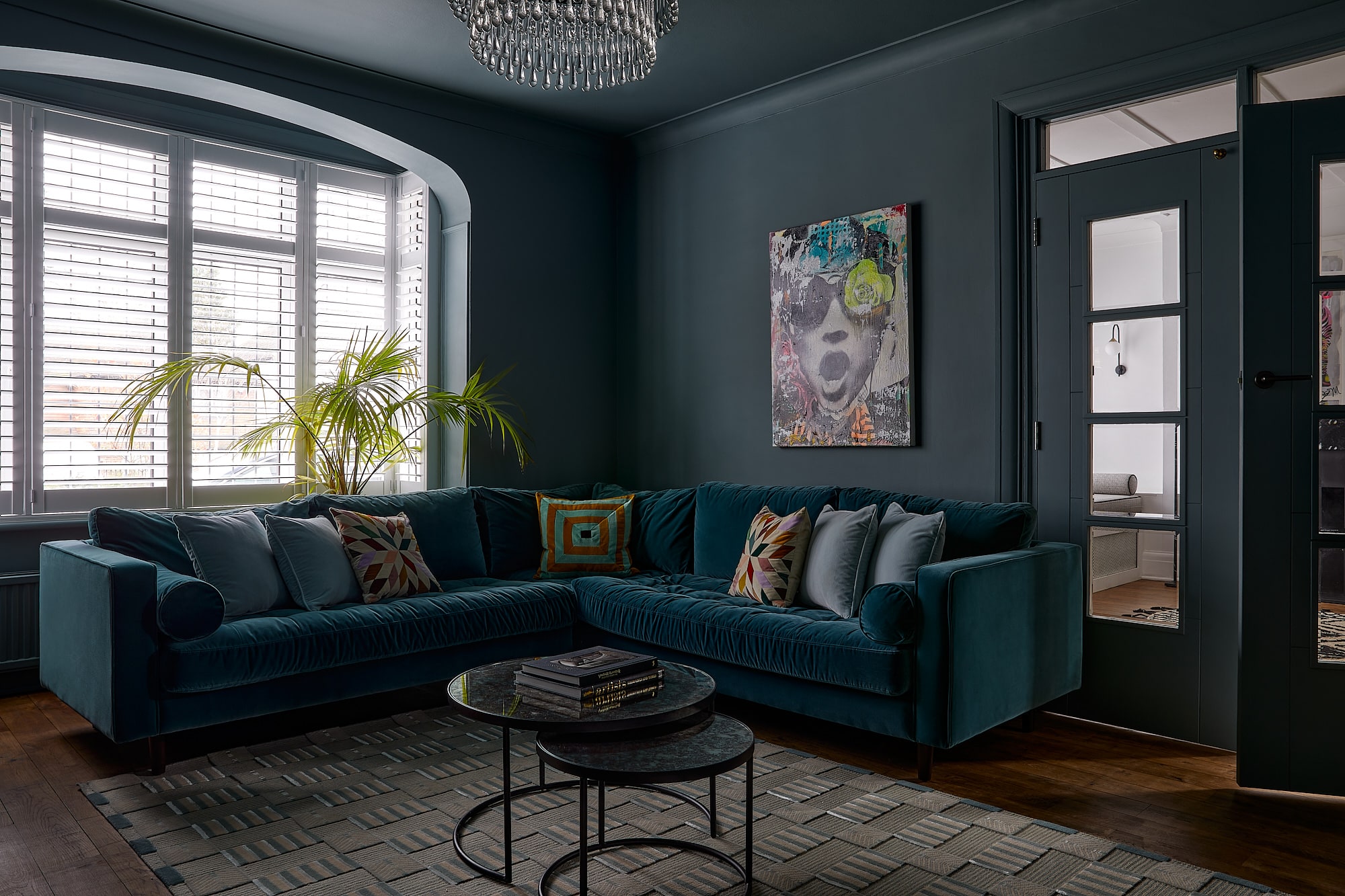 moody dark sitting room with grey blue walls and ceiling