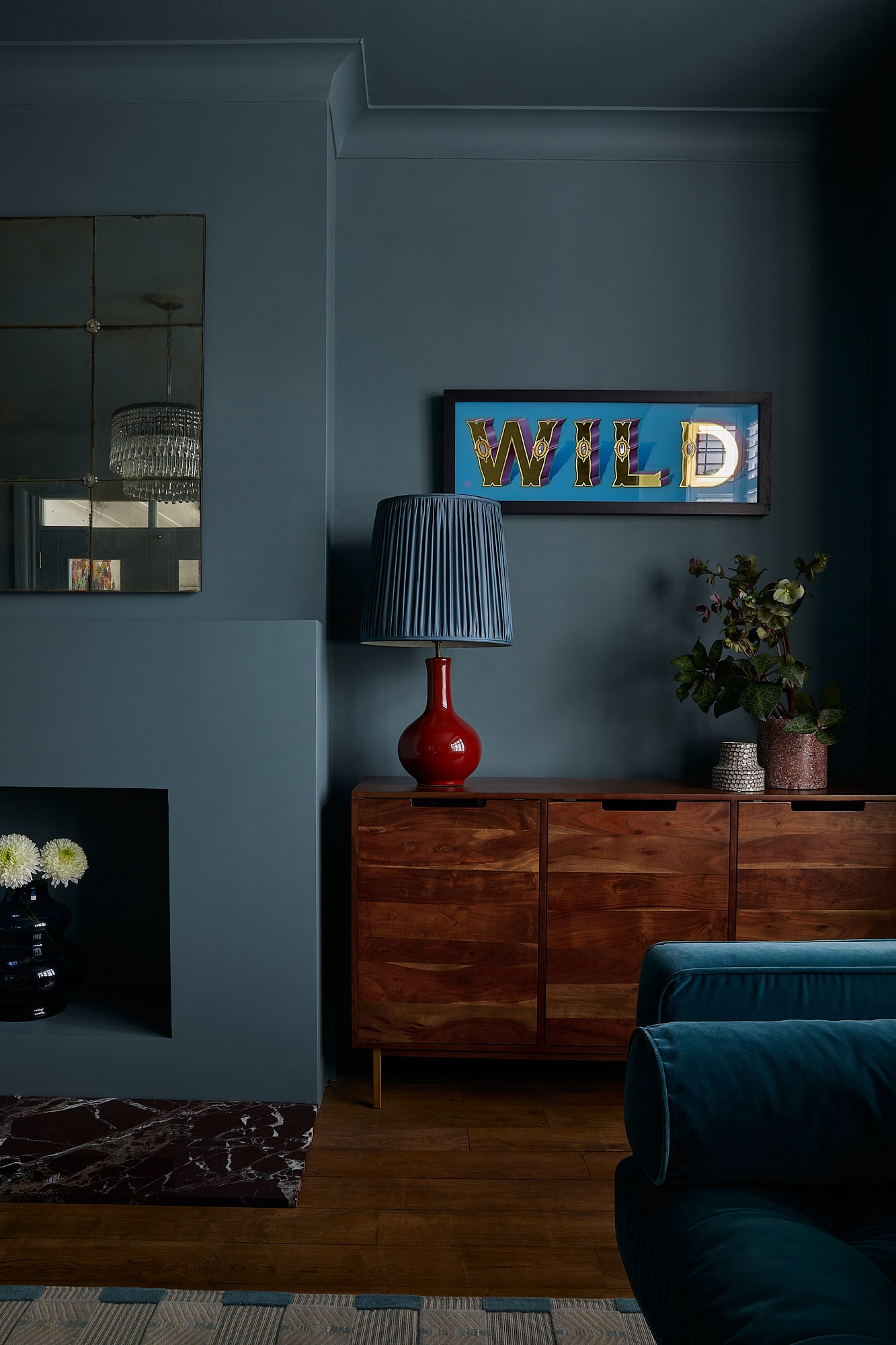 moody dark sitting room with grey blue walls and ceiling