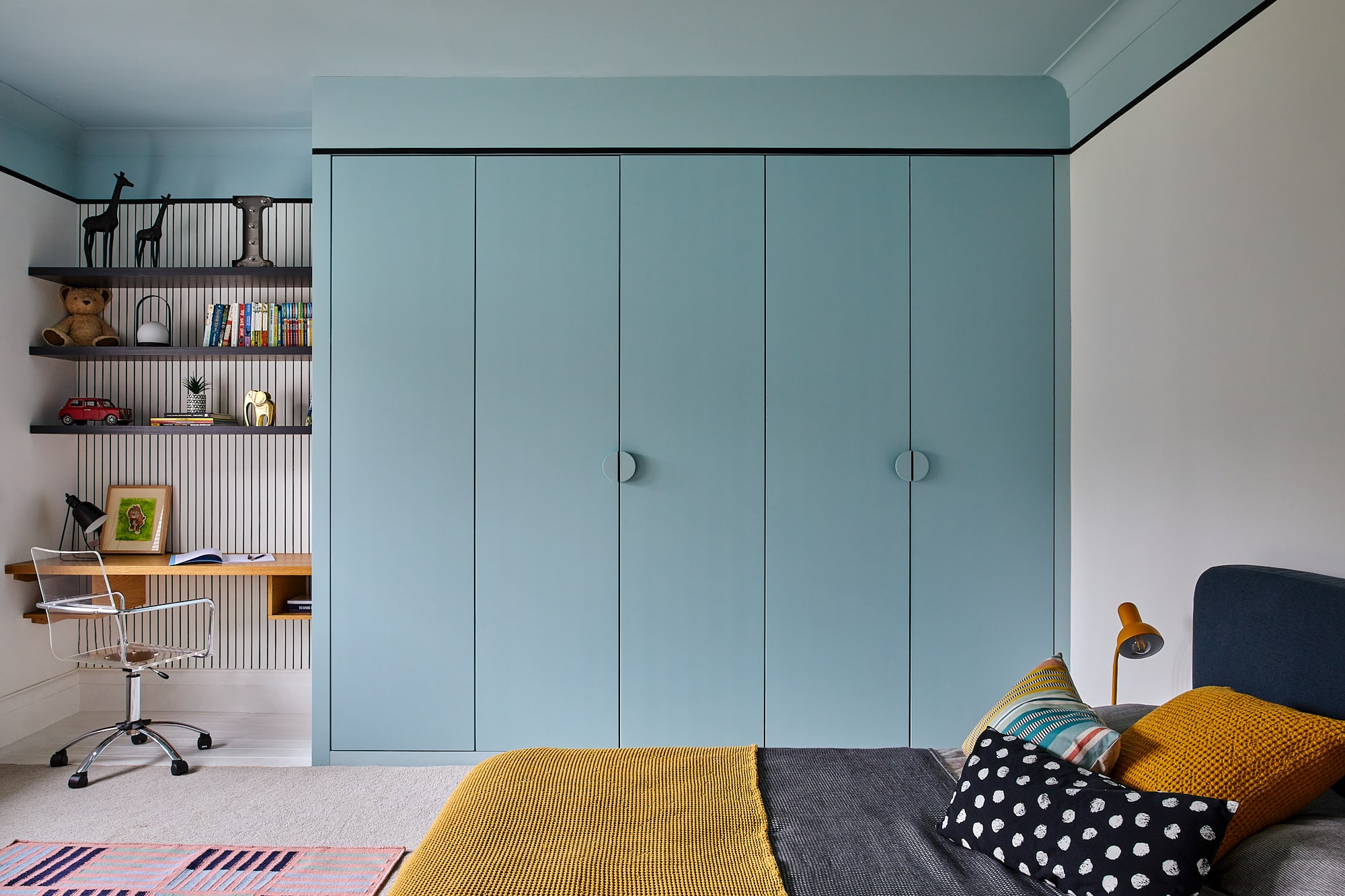 boy's bedroom with blue wardrobe