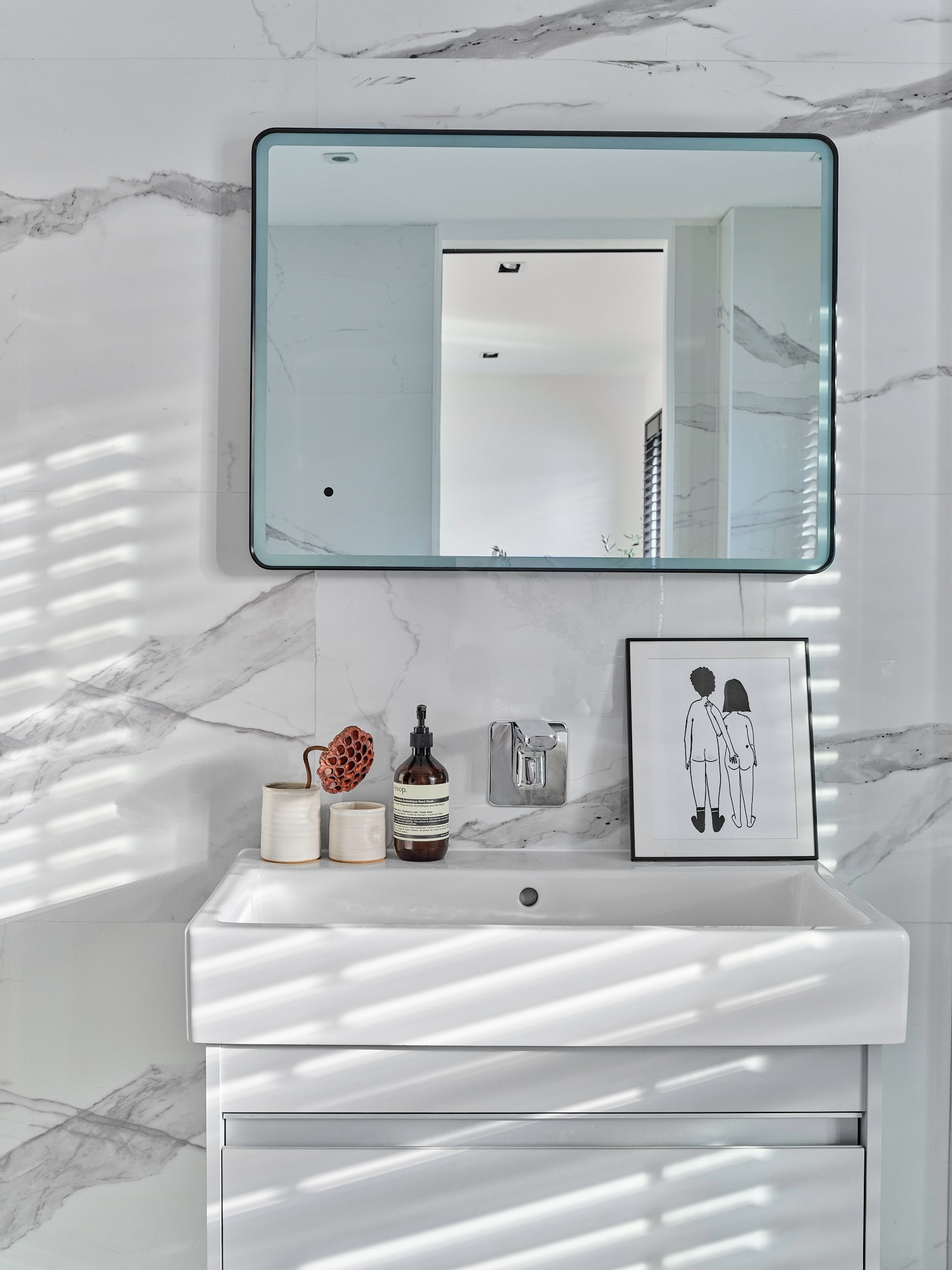 bathroom with square mirror and white sink